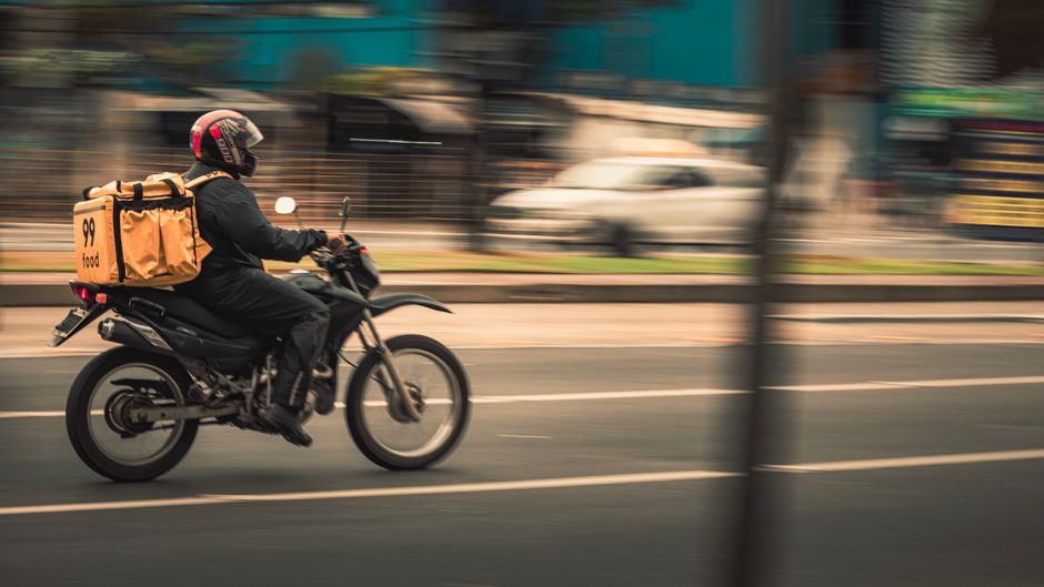 delivery scooter rider speeding through Seoul