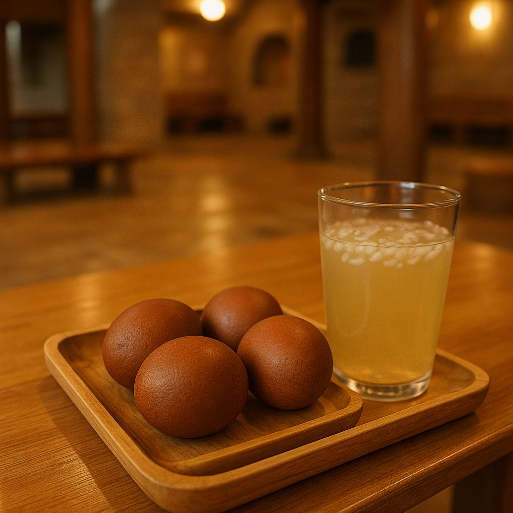 A tray of Korean jjimjilbang baked eggs and a cold glass of sikhye rice punch