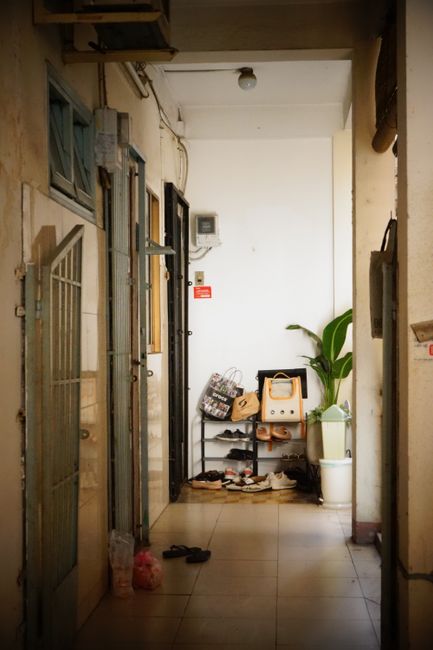 A tidy entryway shoe rack near a lowered floor, similar to a Korean hyeongwan entrance