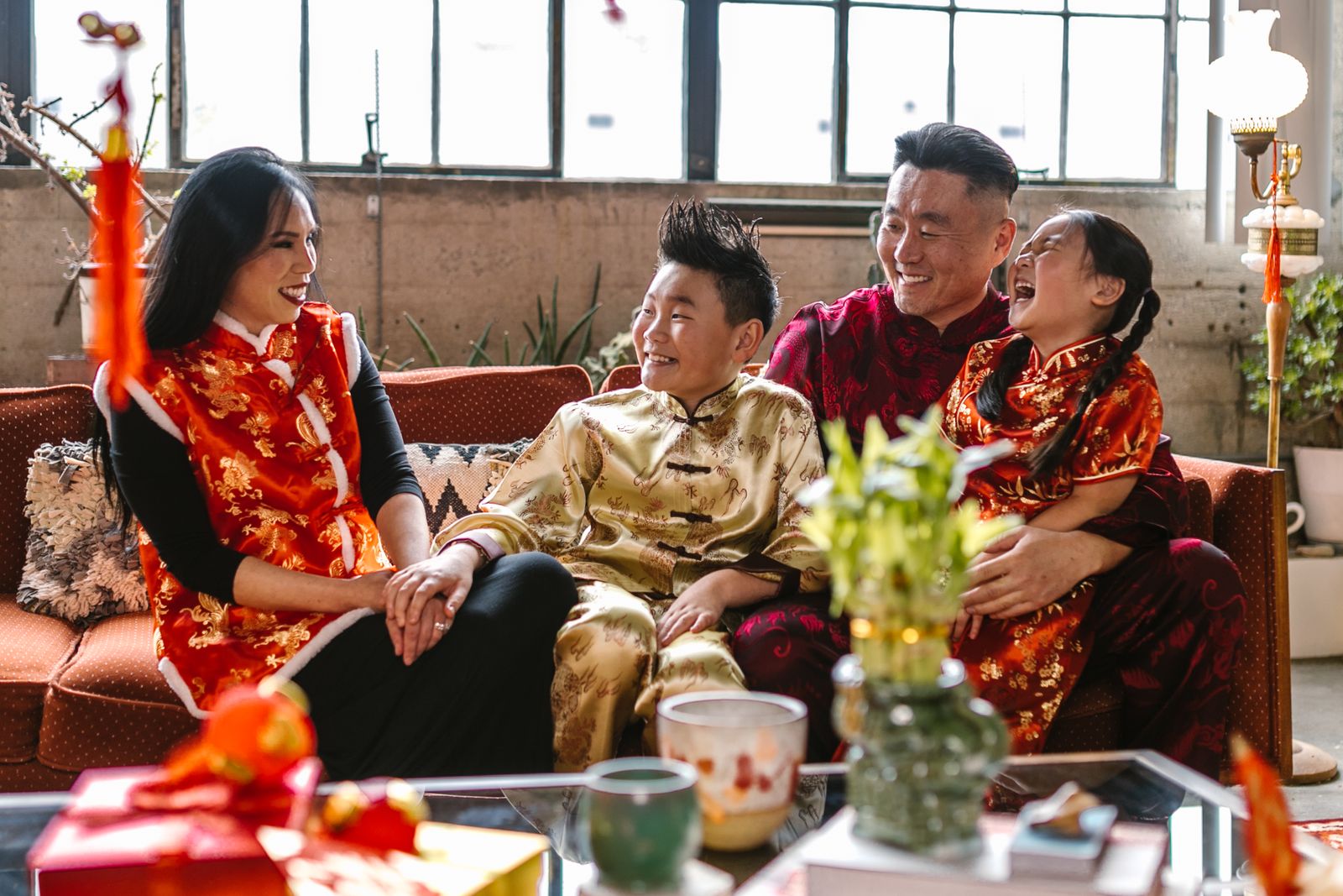 Korean family in traditional hanbok celebrating Lunar New Year together at home