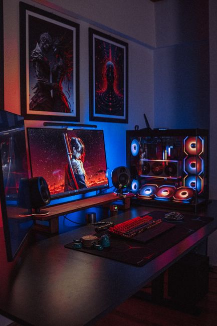 neon-lit gaming PC setup with headset
