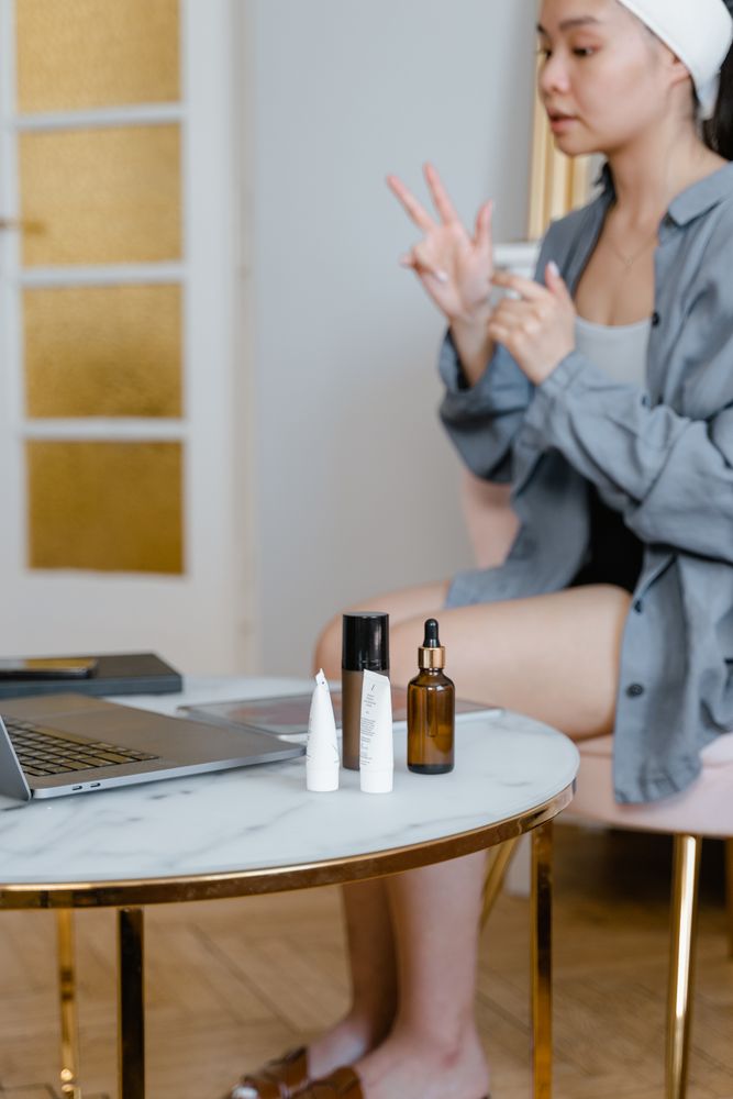 Applying skincare products as part of a daily routine at home