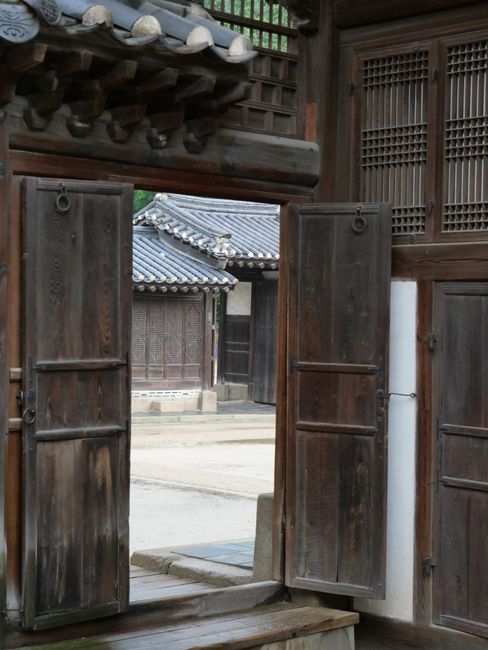 Traditional hanok rooftops in a Seoul hillside neighborhood