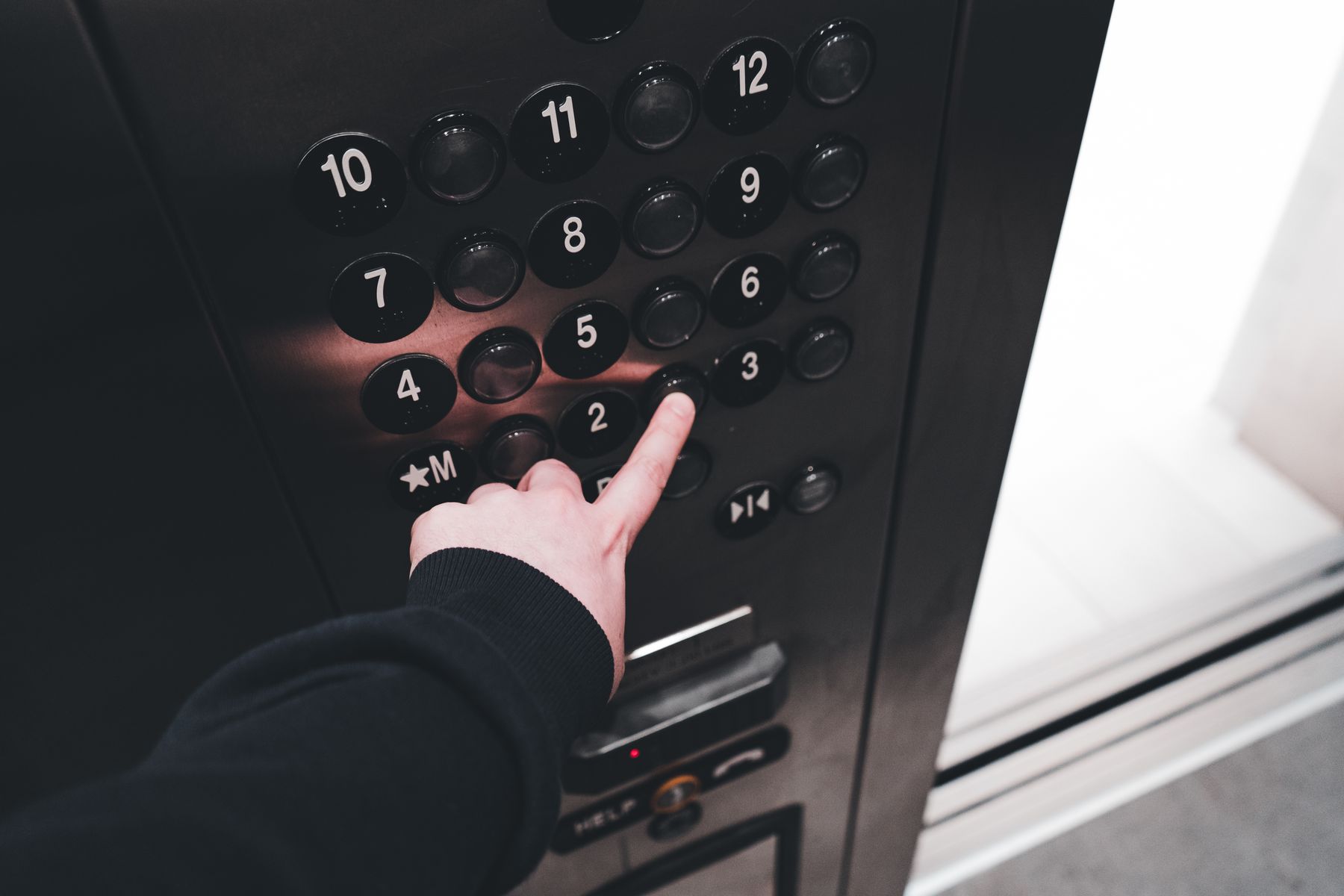 Close-up of an elevator floor button panel in a Korean apartment building