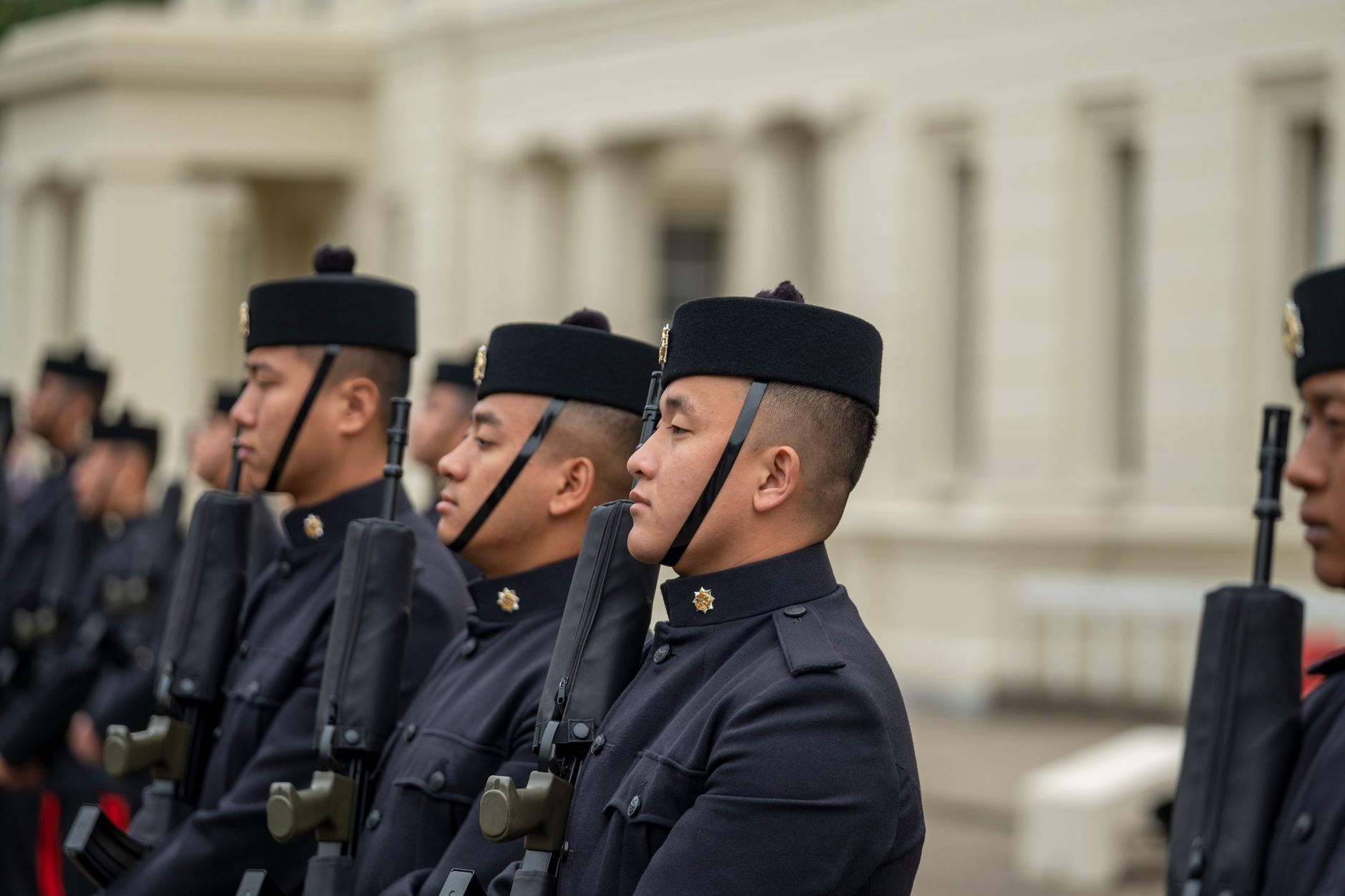 Soldiers standing in formation in dress uniform