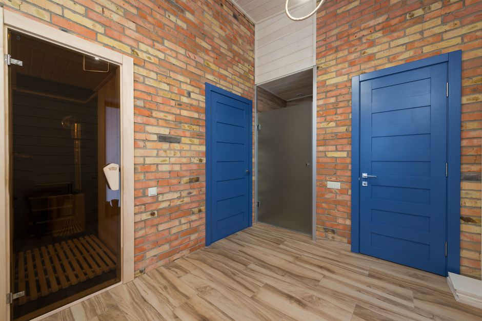 Wooden sauna interior with warm lighting, similar to a Korean kiln sauna room