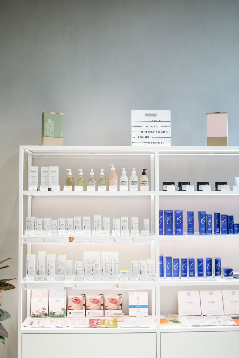 Rows of skincare products neatly displayed on shelves in a beauty retail store