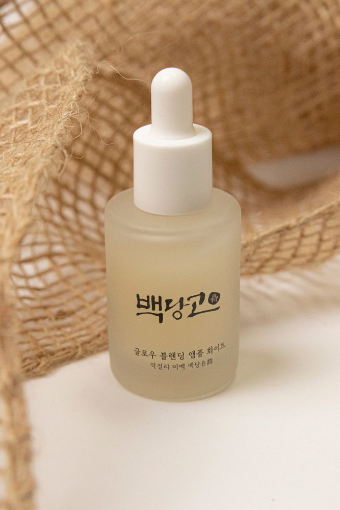 Minimalist serum bottle with Korean text, representing the serum step of a skincare routine