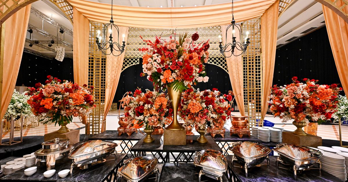 Elegant wedding banquet buffet setup with floral arrangements