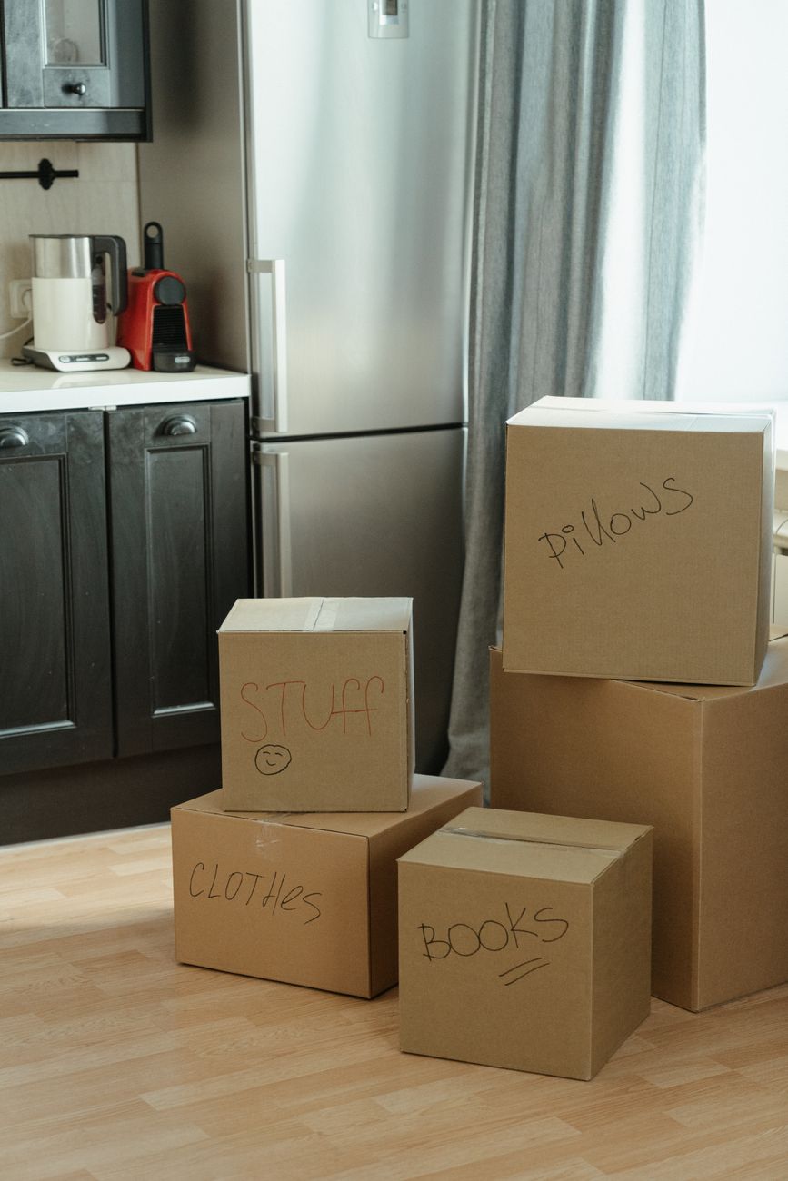 Moving boxes stacked in a kitchen after relocating to a new apartment in Korea