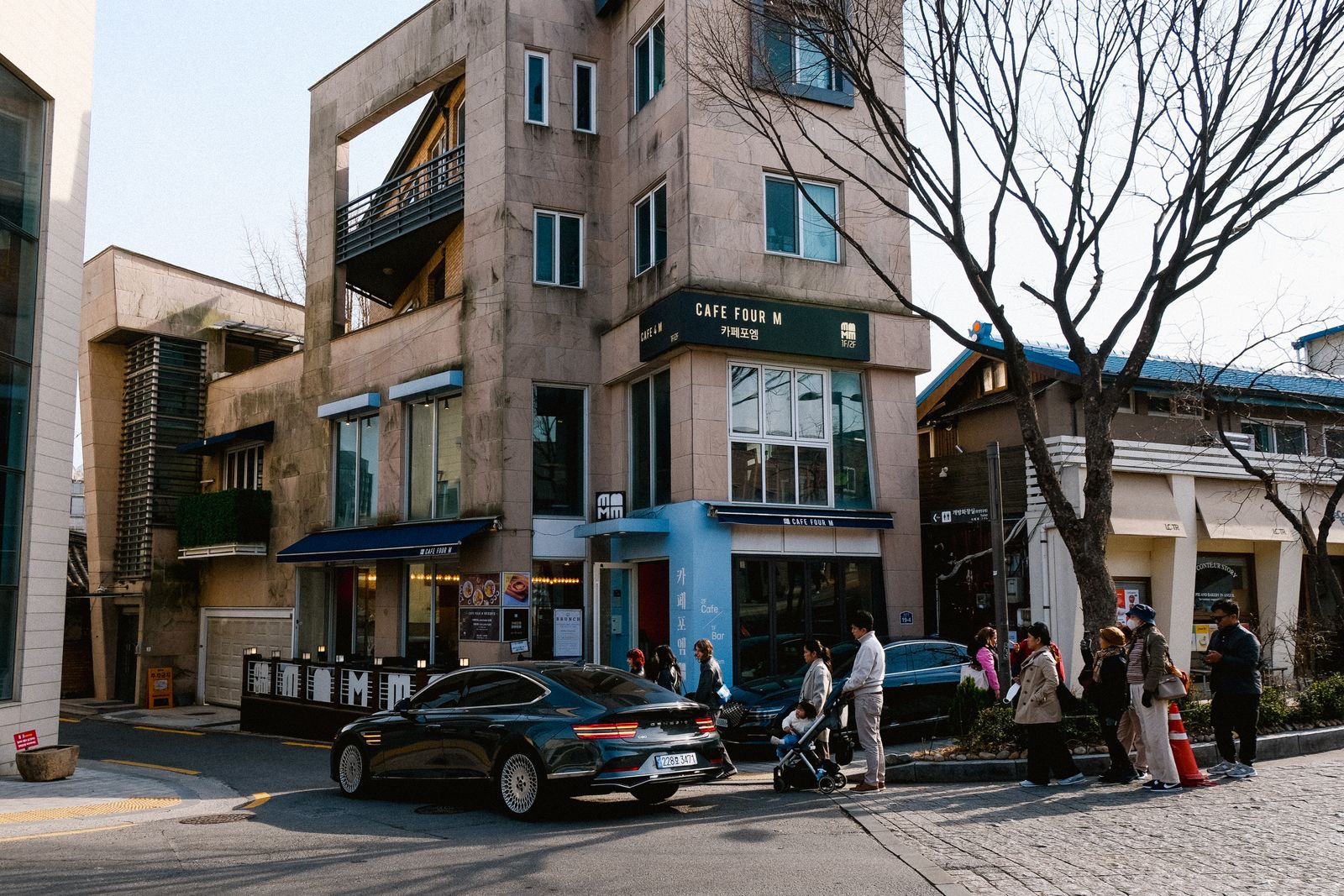 A quiet Seoul side street mixing small workshops, galleries, and local shops