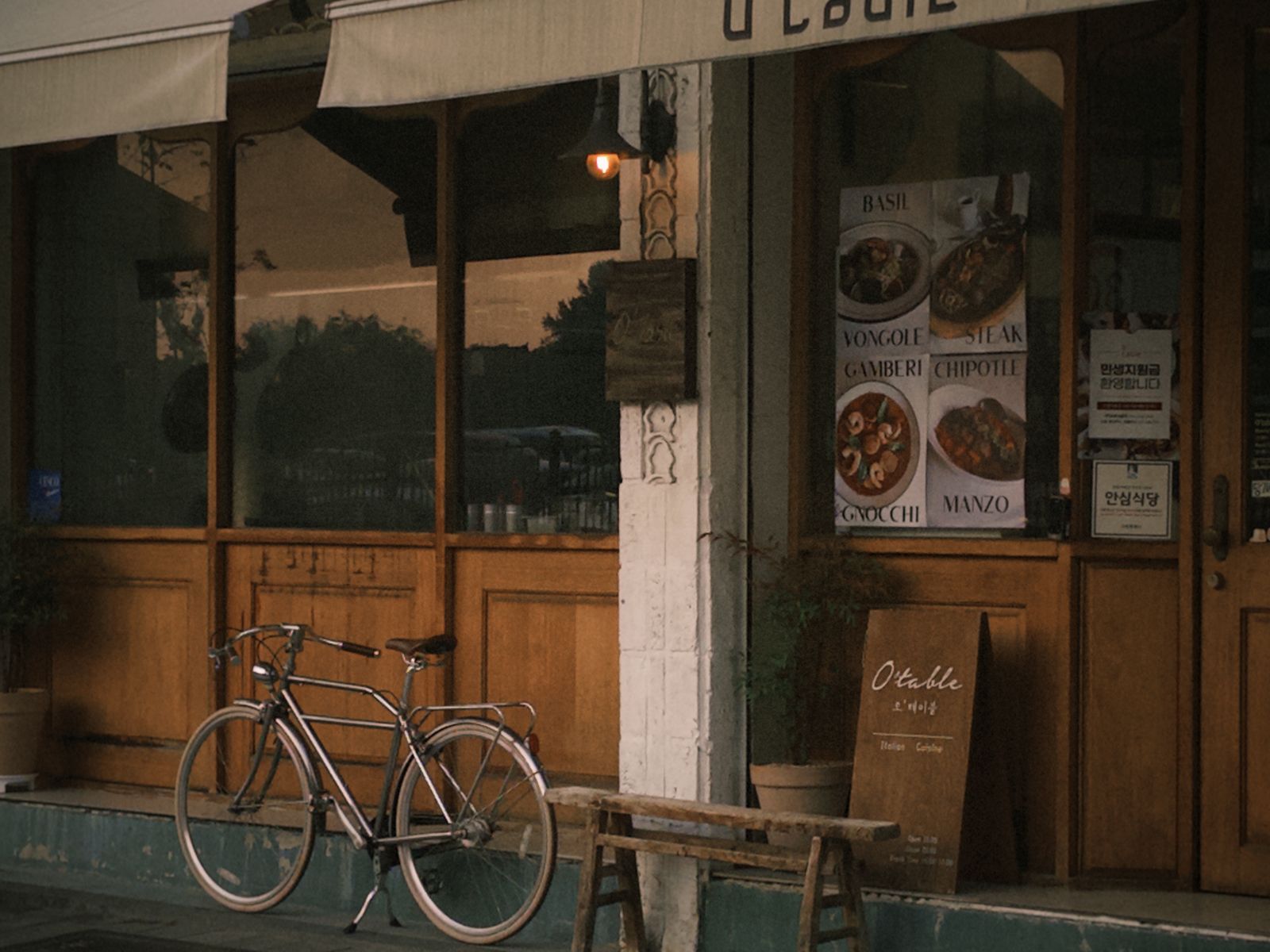 Vintage-style cafe on a Seoul street with a bicycle parked outside