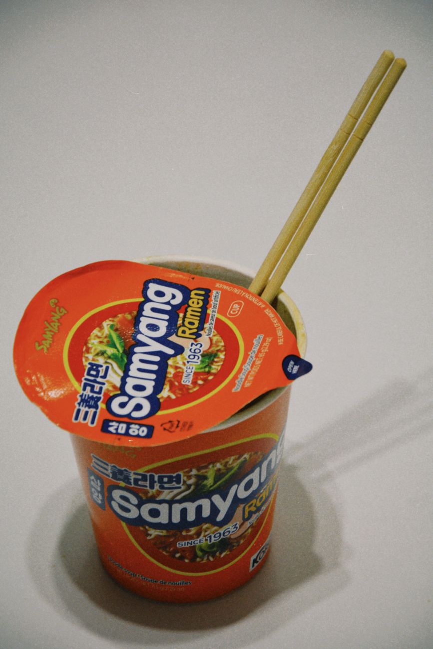 Spicy Korean cup noodles with chopsticks, the kind sold at a convenience store hot water station