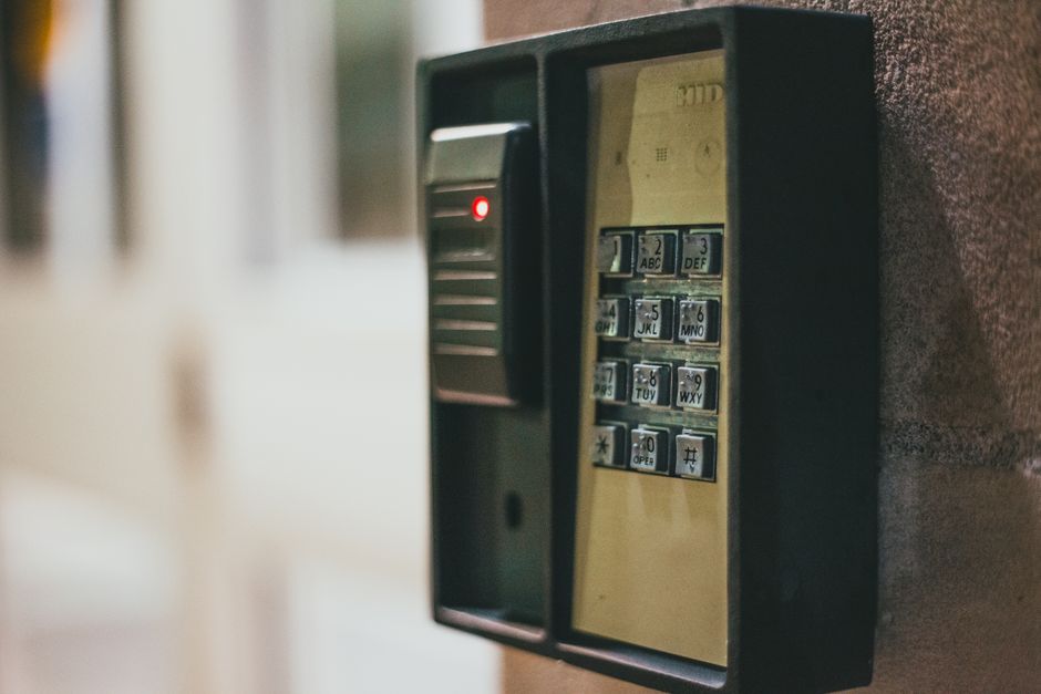 Close-up of a digital security keypad used for keyless apartment entry
