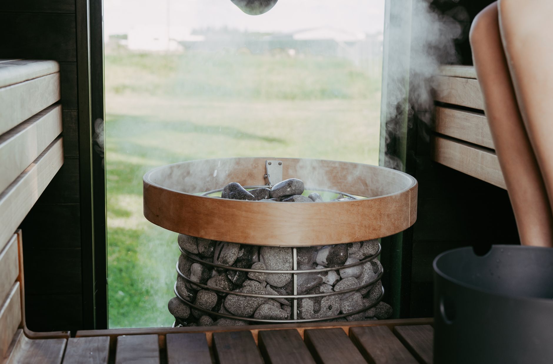 Cozy indoor sauna room with steaming stones