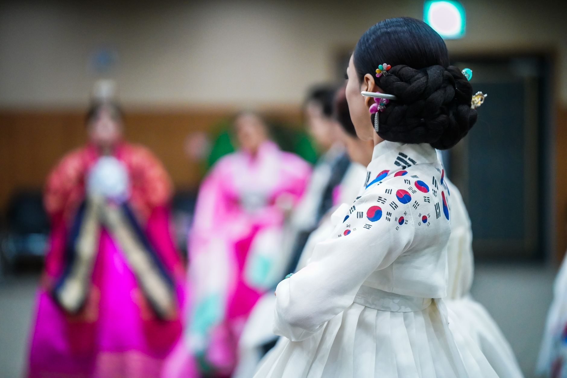 Woman in elegant traditional hanbok during a cultural ceremony
