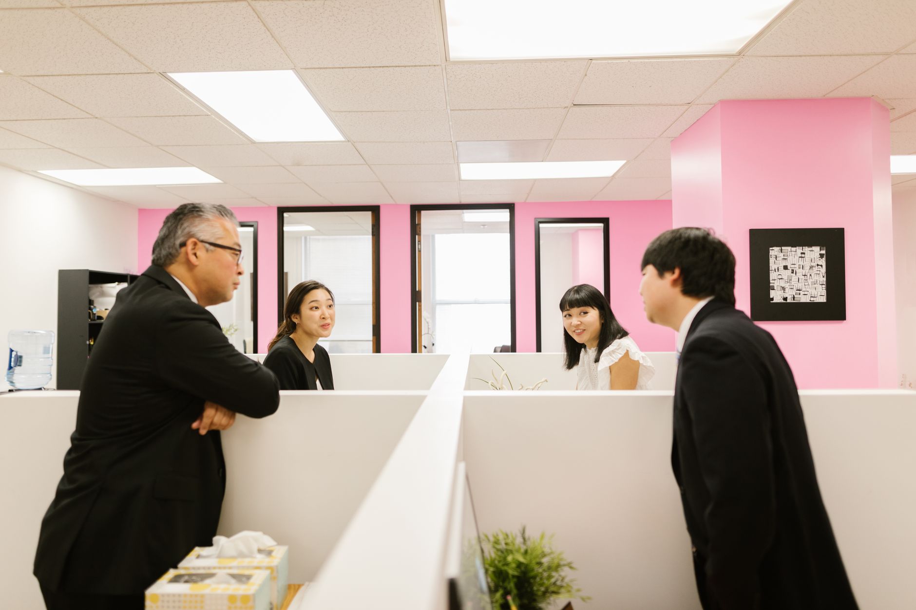 Colleagues in a lively discussion in a modern office setting