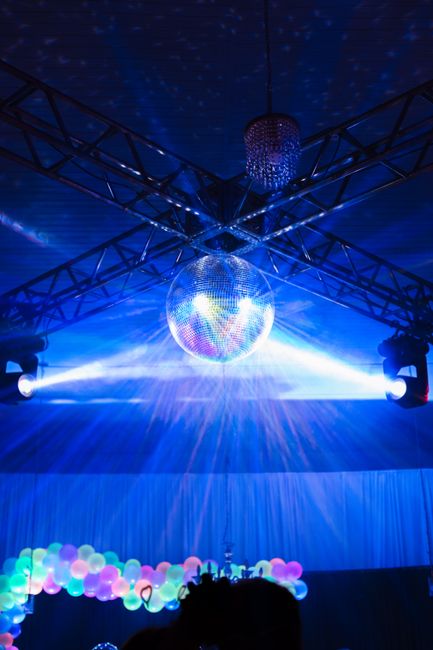 Disco ball and party lighting inside a nightlife venue, similar to a luxury noraebang