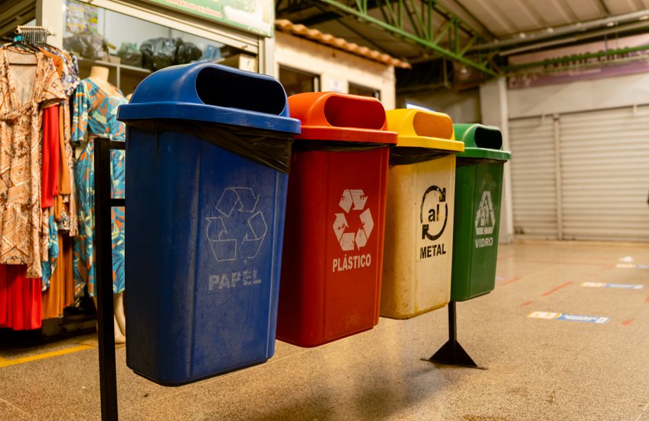 Color-coded recycling bins used for household waste sorting