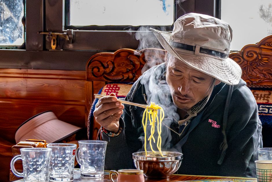 Person eating alone at a restaurant counter in Korea